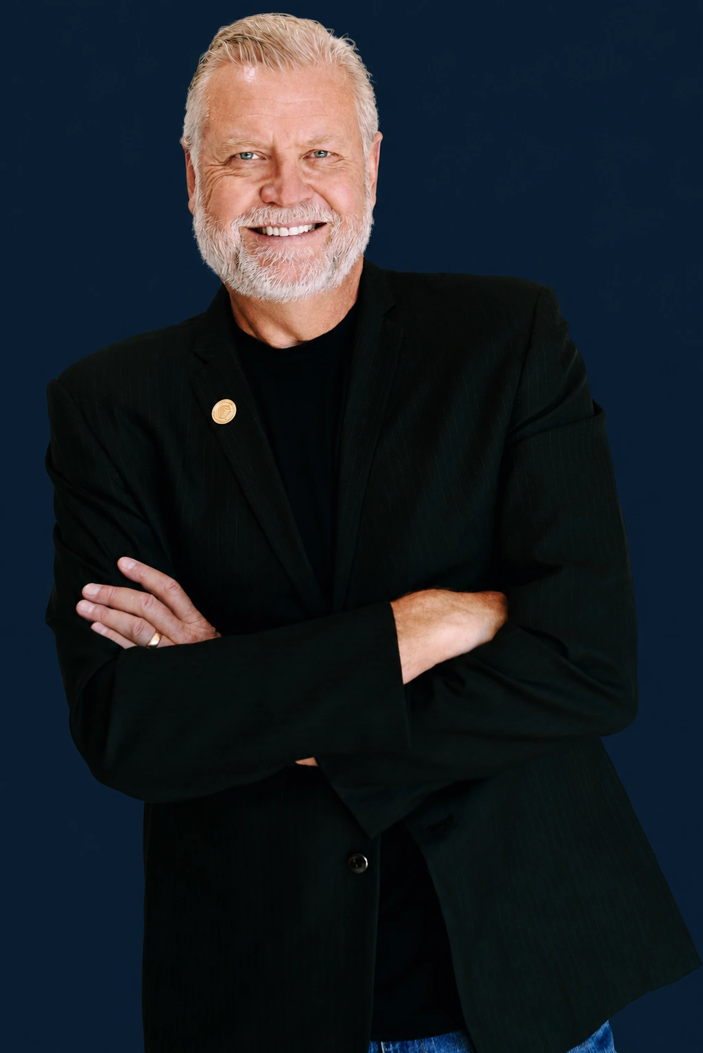 Douglass Lodmell smiling with his arms crossed